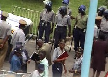 Riot police welcome crown at Town Hall